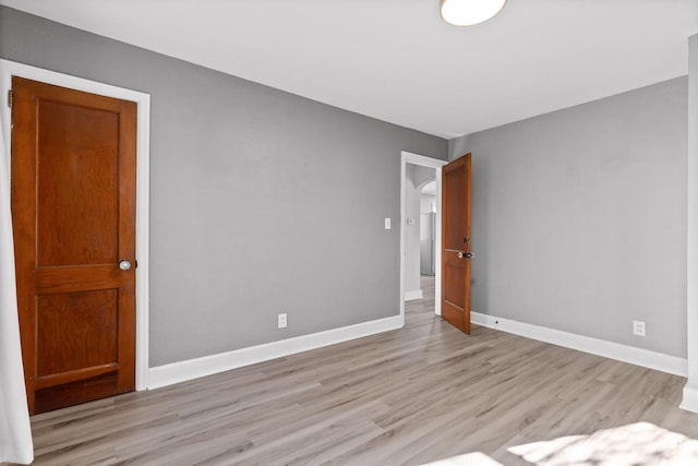 empty room with light wood-type flooring