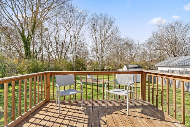 wooden deck featuring a yard