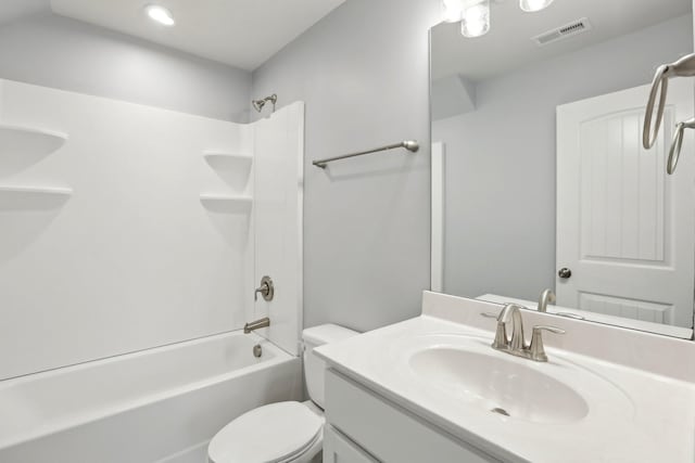 full bathroom featuring toilet, vanity, and bathing tub / shower combination