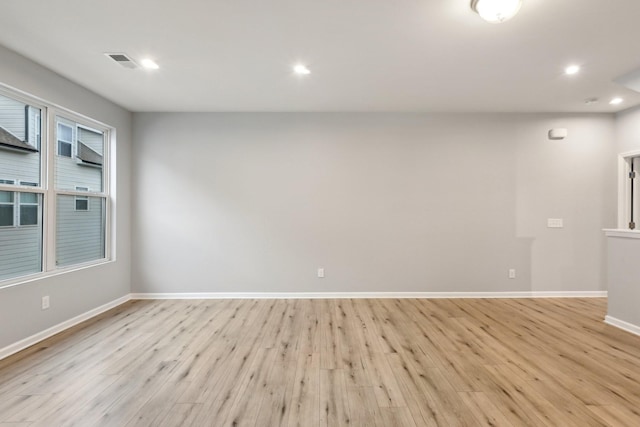 unfurnished room featuring light hardwood / wood-style flooring