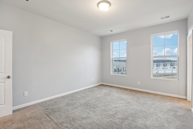 empty room with carpet flooring