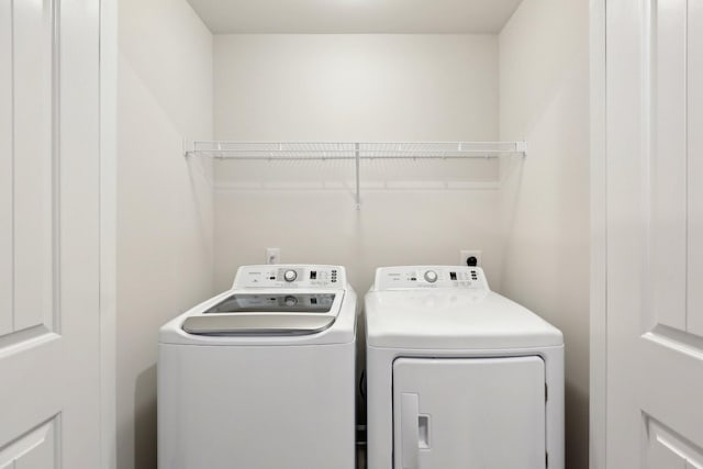 washroom with separate washer and dryer