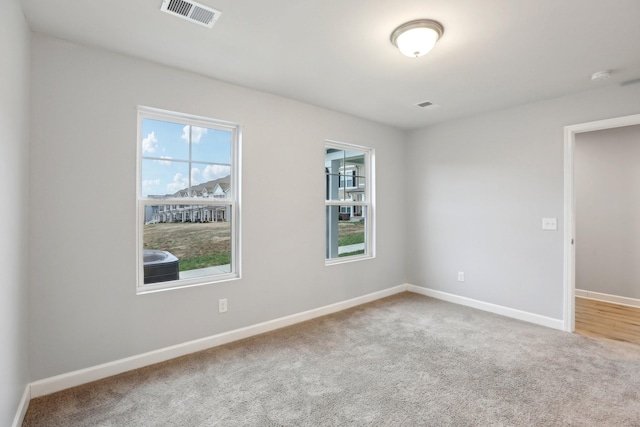 spare room featuring carpet flooring