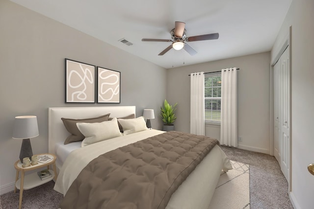 bedroom with ceiling fan, light colored carpet, and a closet