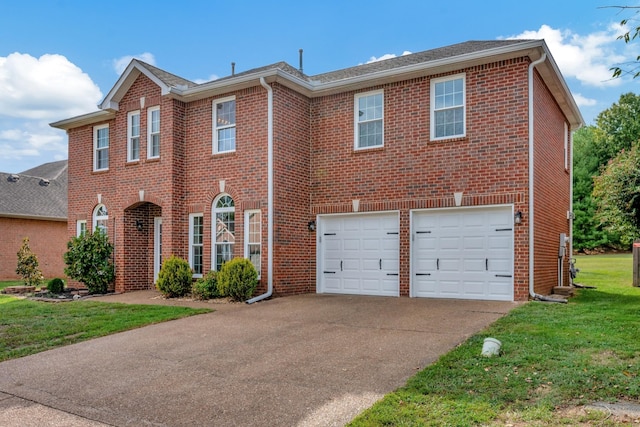 view of front of home with a garage and a front yard