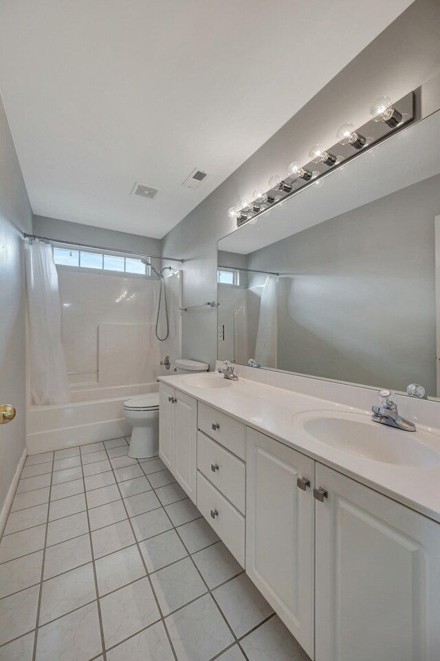 full bathroom with tile patterned floors, vanity, toilet, and shower / tub combo with curtain