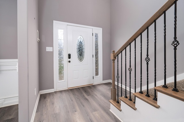 foyer entrance with hardwood / wood-style floors