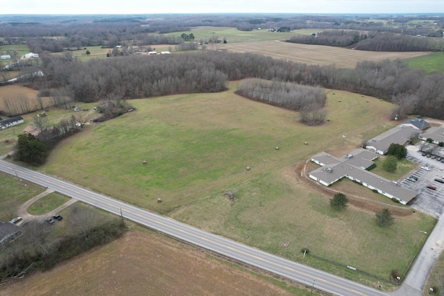 birds eye view of property with a rural view