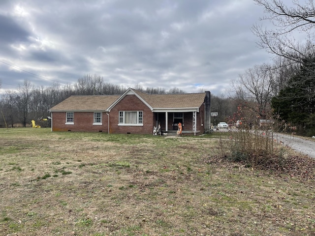 ranch-style home with a front lawn