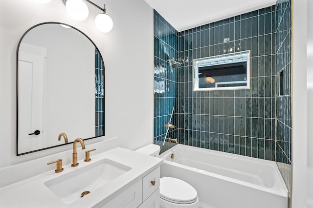 full bathroom with tiled shower / bath combo, toilet, and vanity