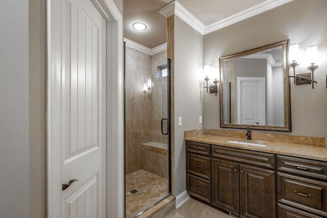 bathroom with tile patterned flooring, vanity, an enclosed shower, and crown molding