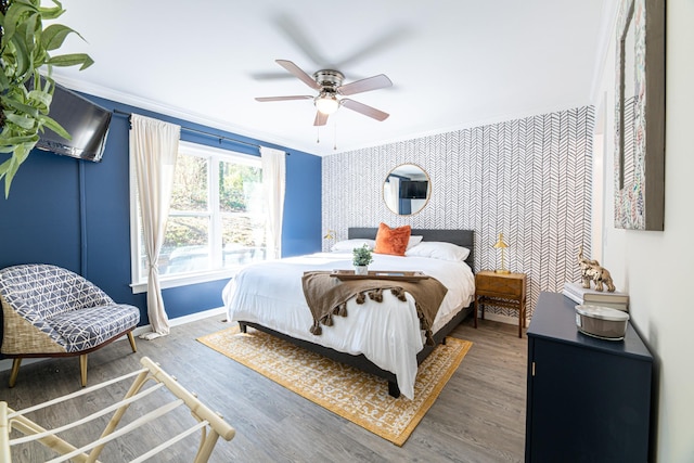 bedroom with ceiling fan, dark hardwood / wood-style flooring, and crown molding
