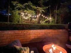exterior space with a fire pit