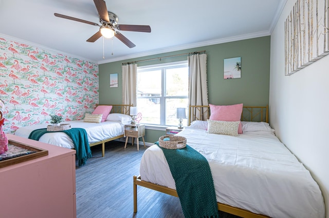 bedroom featuring ceiling fan, wood-type flooring, and ornamental molding