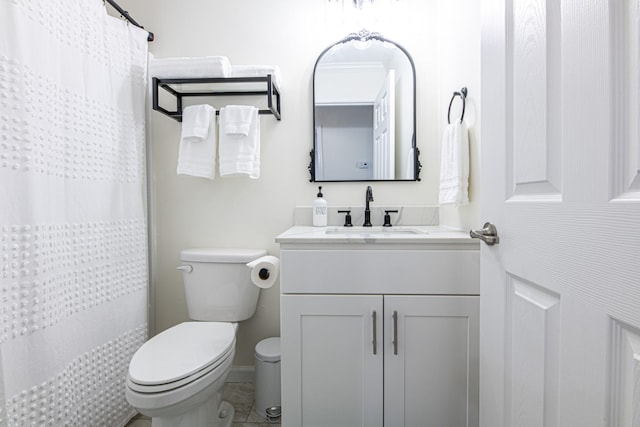 bathroom with toilet and vanity
