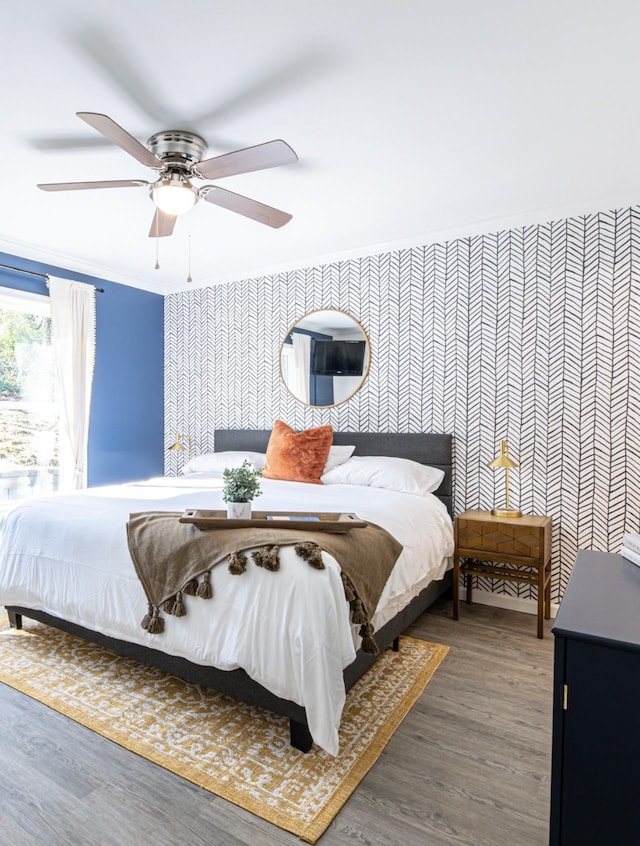 bedroom with ceiling fan and dark hardwood / wood-style flooring