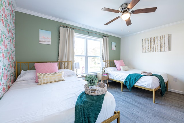 bedroom with ceiling fan, ornamental molding, and hardwood / wood-style flooring