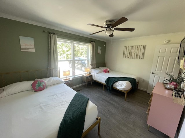 bedroom with ceiling fan, dark wood-type flooring, and ornamental molding