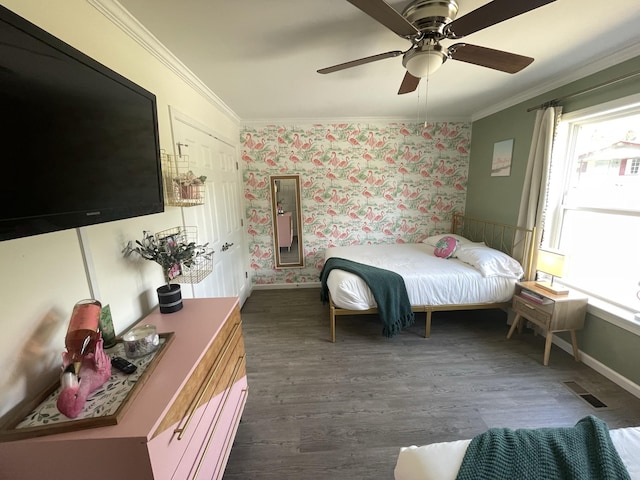 bedroom featuring ceiling fan, dark wood-type flooring, and ornamental molding