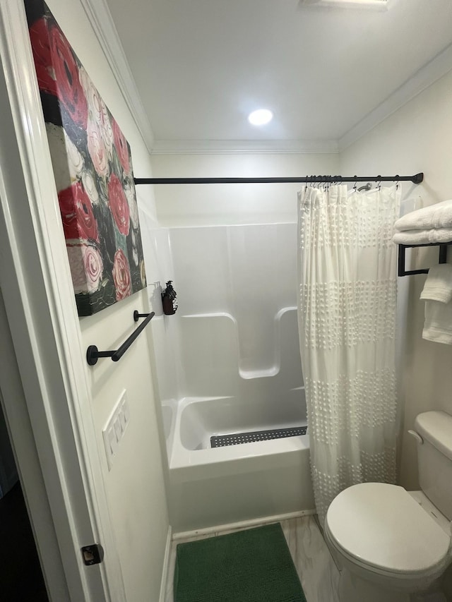 bathroom featuring shower / bath combo with shower curtain, toilet, and ornamental molding