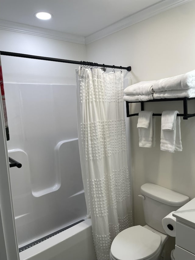 bathroom featuring toilet, crown molding, and vanity