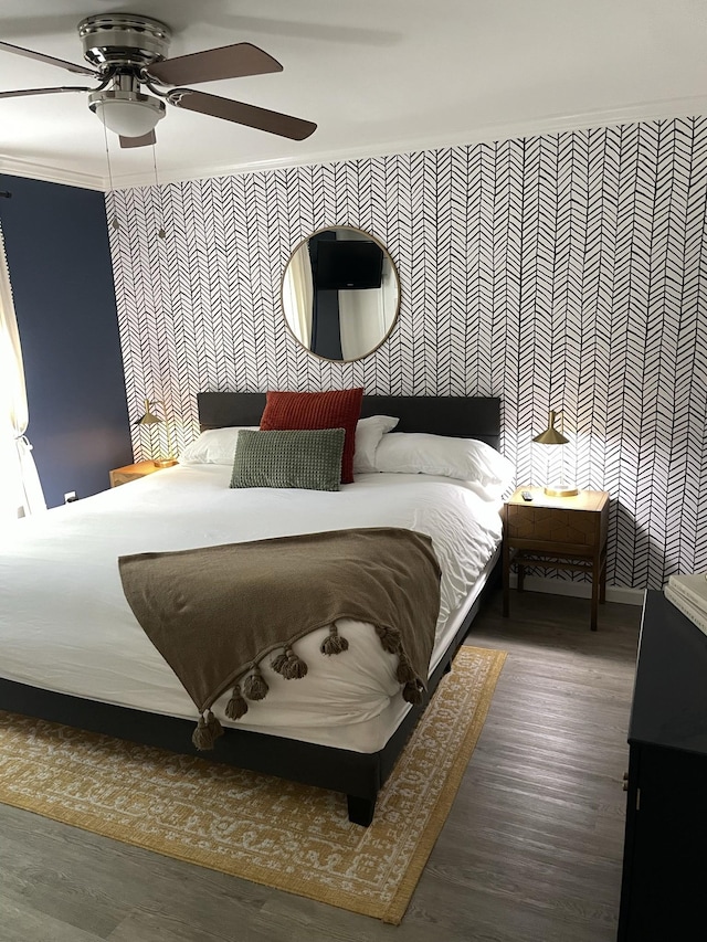 bedroom featuring ceiling fan and dark hardwood / wood-style floors
