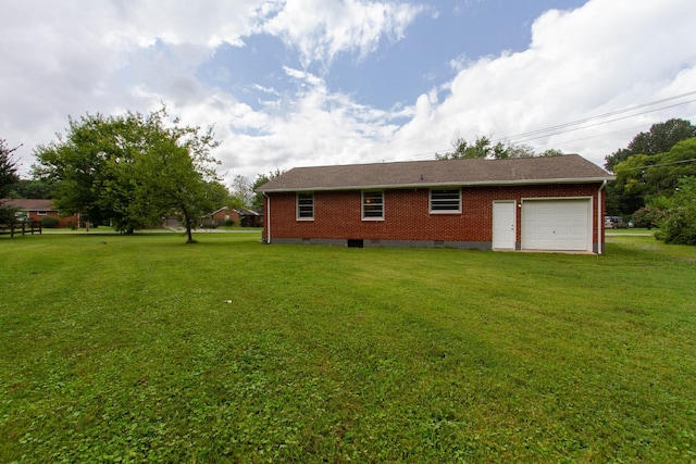 exterior space with a lawn and a garage