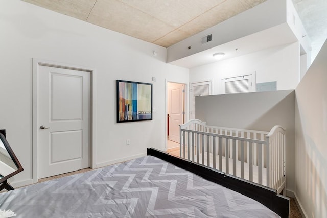 bedroom with light colored carpet