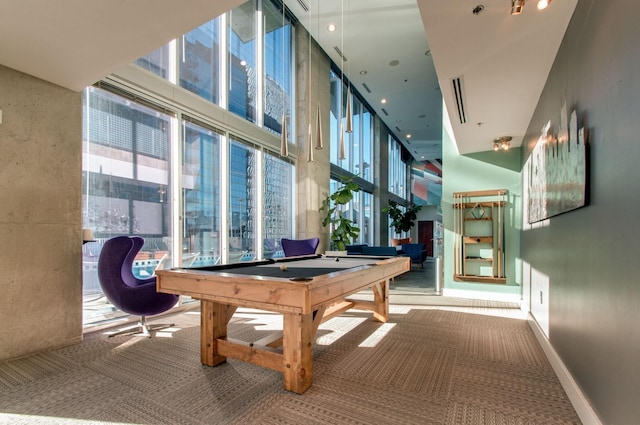 game room featuring carpet, expansive windows, a towering ceiling, and pool table