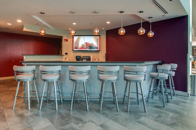 bar featuring decorative light fixtures