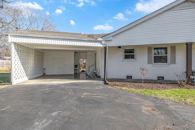 view of side of home featuring a carport