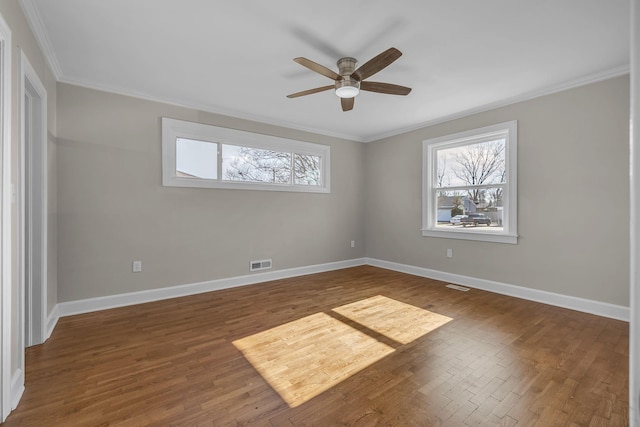 unfurnished room with ceiling fan and crown molding