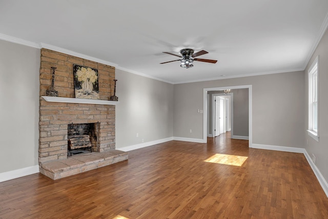 unfurnished living room with a fireplace, ceiling fan, hardwood / wood-style floors, and ornamental molding