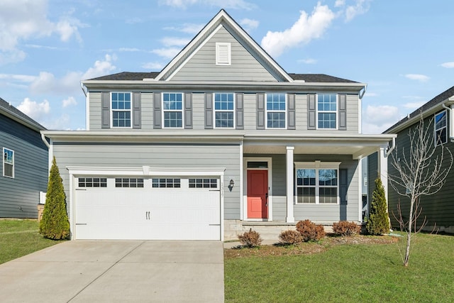 view of front of home featuring a front lawn and a garage