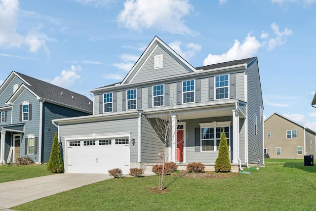 view of front of property with a front yard and a garage