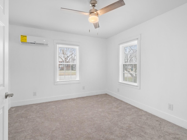 carpeted empty room featuring an AC wall unit and ceiling fan