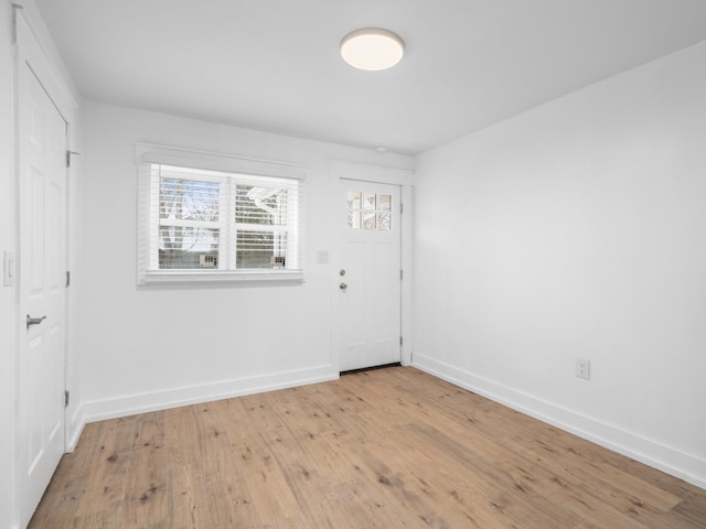 spare room with light hardwood / wood-style flooring