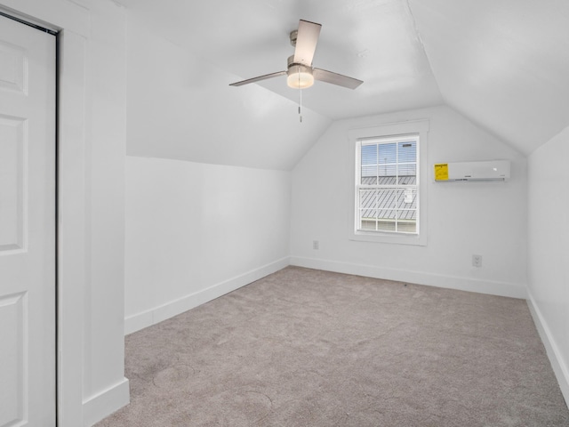 bonus room with ceiling fan, lofted ceiling, light carpet, and a wall mounted AC