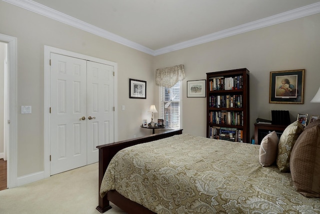 carpeted bedroom featuring a closet and ornamental molding