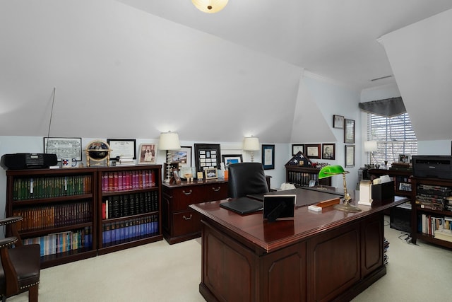 carpeted office with vaulted ceiling