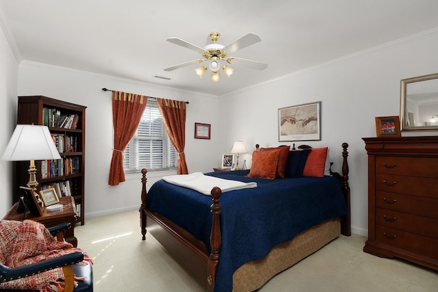 carpeted bedroom featuring ceiling fan and crown molding