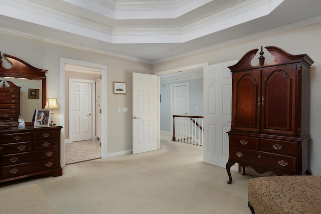 sitting room with light carpet, a tray ceiling, and crown molding