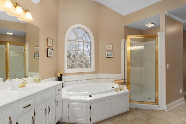 bathroom featuring tile patterned floors, vanity, and shower with separate bathtub