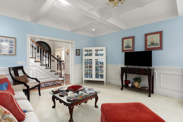 living room with beamed ceiling, light colored carpet, ornamental molding, and coffered ceiling