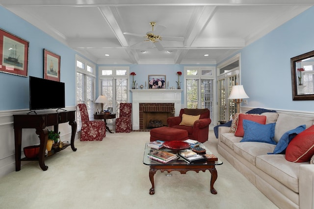 living room featuring a wealth of natural light, coffered ceiling, beamed ceiling, light carpet, and a fireplace