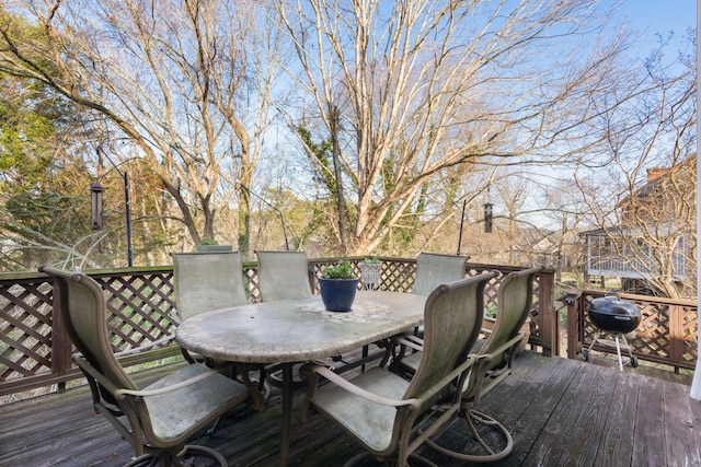 wooden deck with a grill