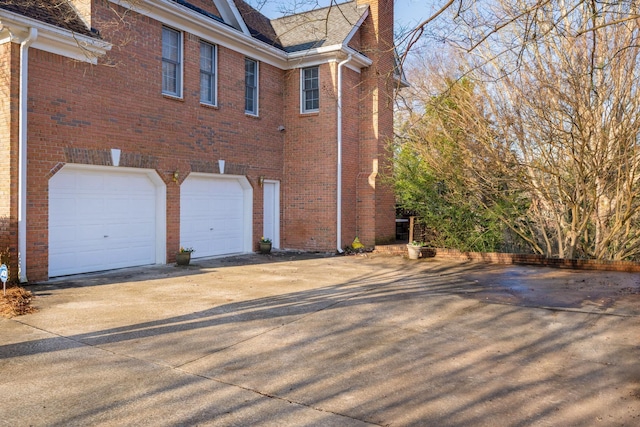 view of property exterior with a garage