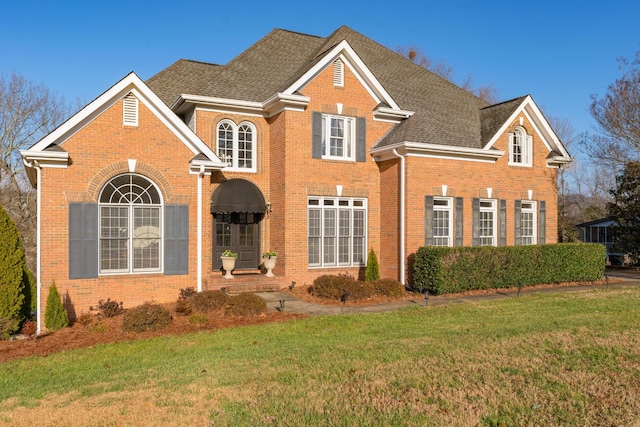 front facade with a front lawn