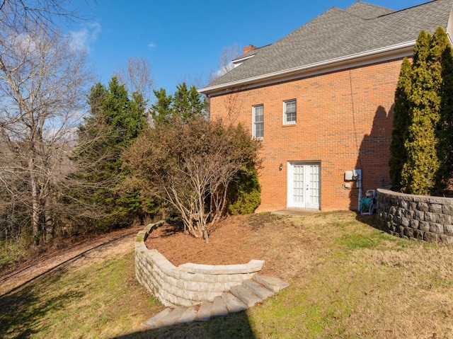 rear view of property with a yard and french doors