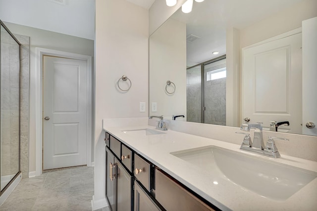 bathroom with tile patterned floors, vanity, and walk in shower